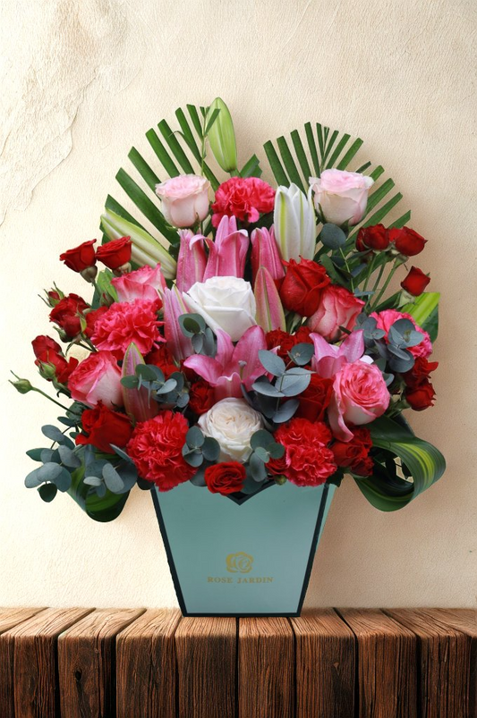 Elegant Floral Arrangement in Blue Vase